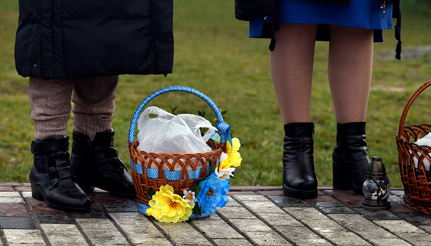 Ukrainian Easter basket decorated with blue and yellow flowers and ribbon