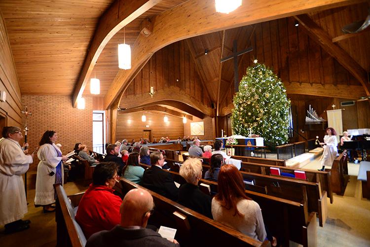 The tree is lit for the congregation at the Chrismon tree lighting service on Sunday, December 11, 2016