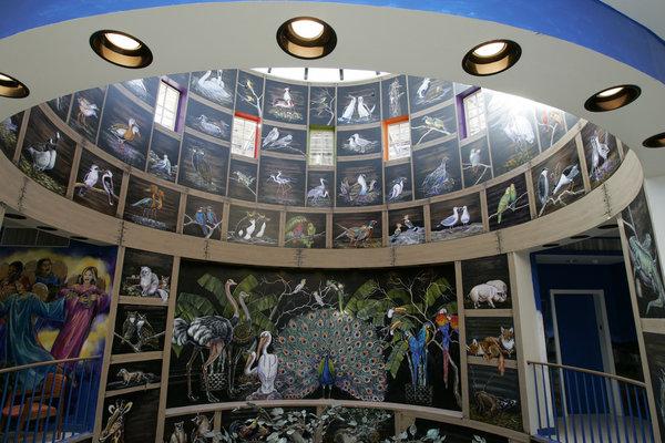 A three-story rotunda forms an aviary where birds both exotic and familiar perch.