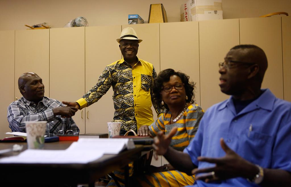 Moise Mukanya, James and Mary Arthur and John Henry Coker meet for Sunday School class at Westbury UMC