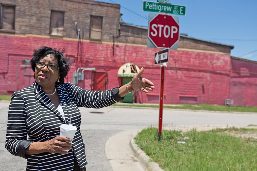 Annie Ward, the vice chairman of the board of directors for St. John CDC, shows the area where dilapidated houses once stood in East Wilson.