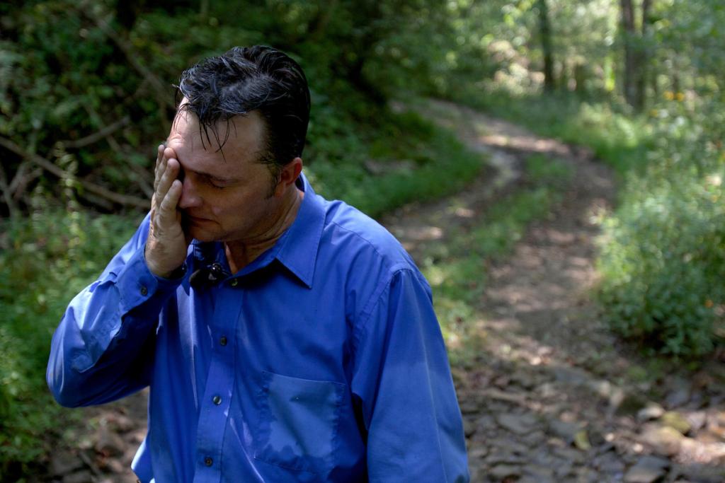 Mack mops his brow during a September 2011 serpent hunt in Panther, West Virginia.