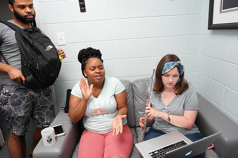 Janae Durr (seated, left) of Chicago and Olivia Haynes of Stafford County, Virginia, make final tweaks to a new Urban Doxology worship song.