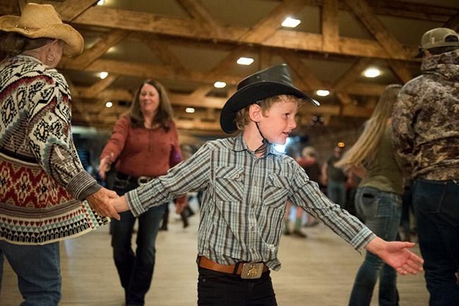 A young cowboy joins in the fun at St. Thomas' Tuesday night square dance.