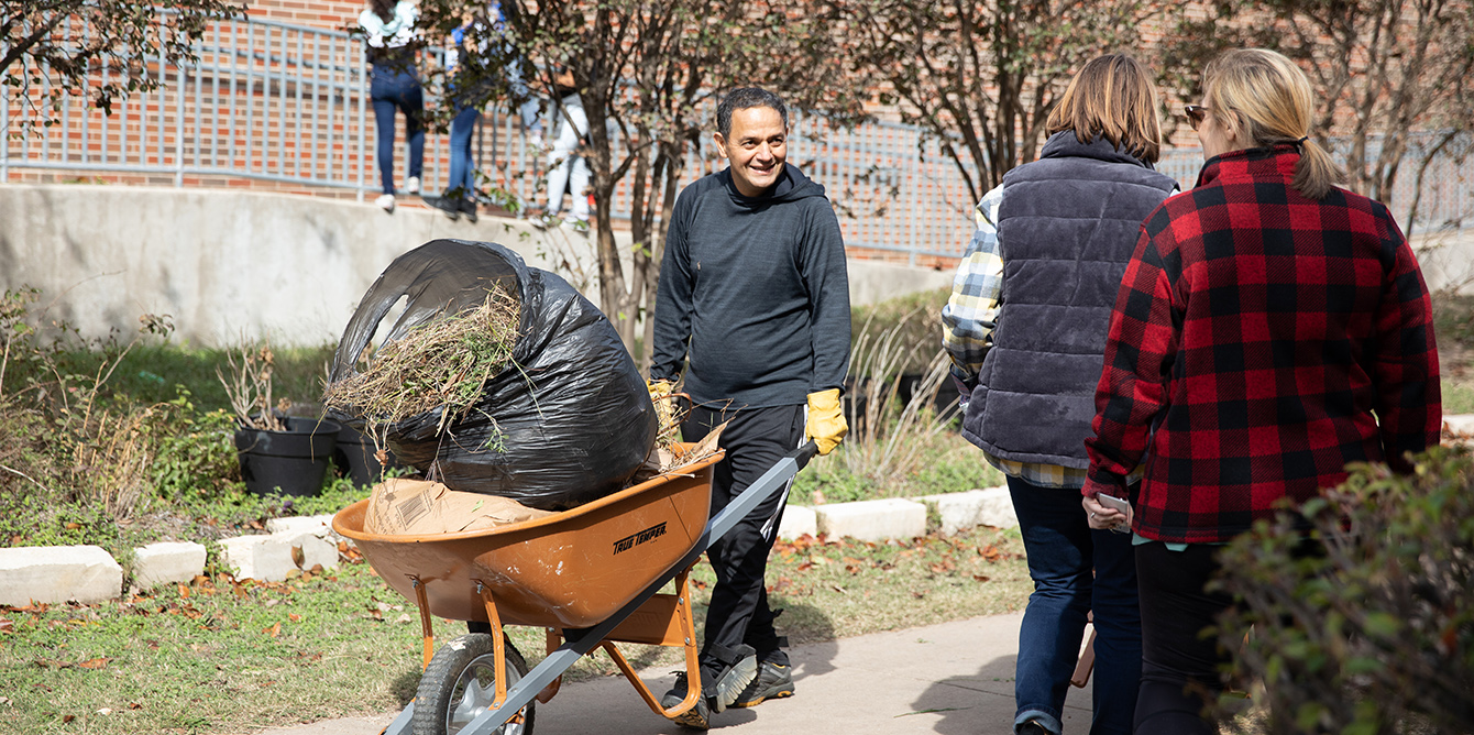 volunteer with wheelbarrow