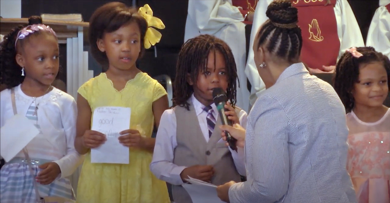 image of children speaking in a church