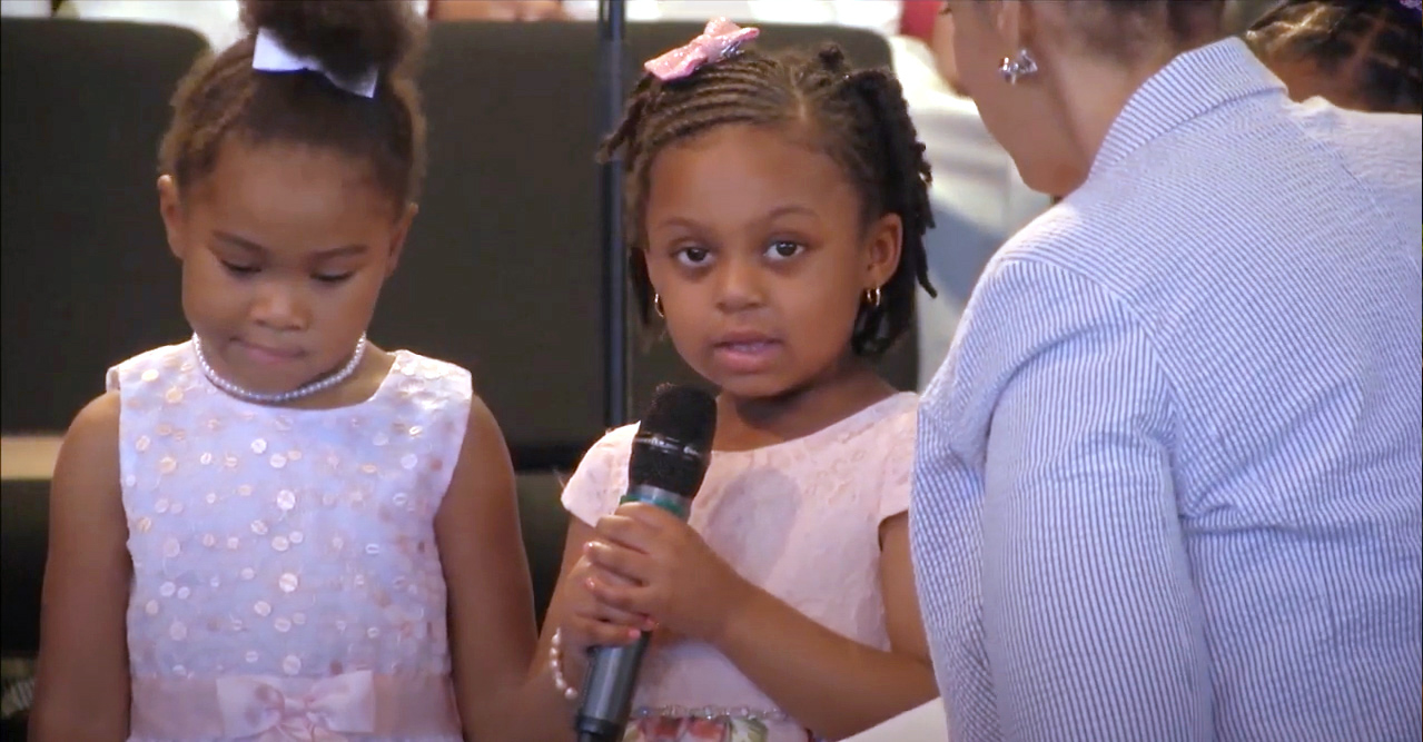 image of a girl speaking in church