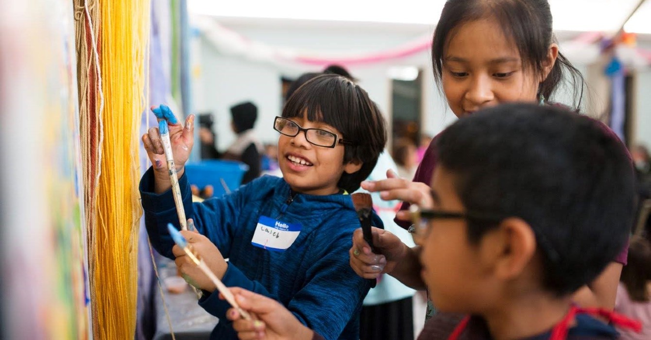 image of three kids painting