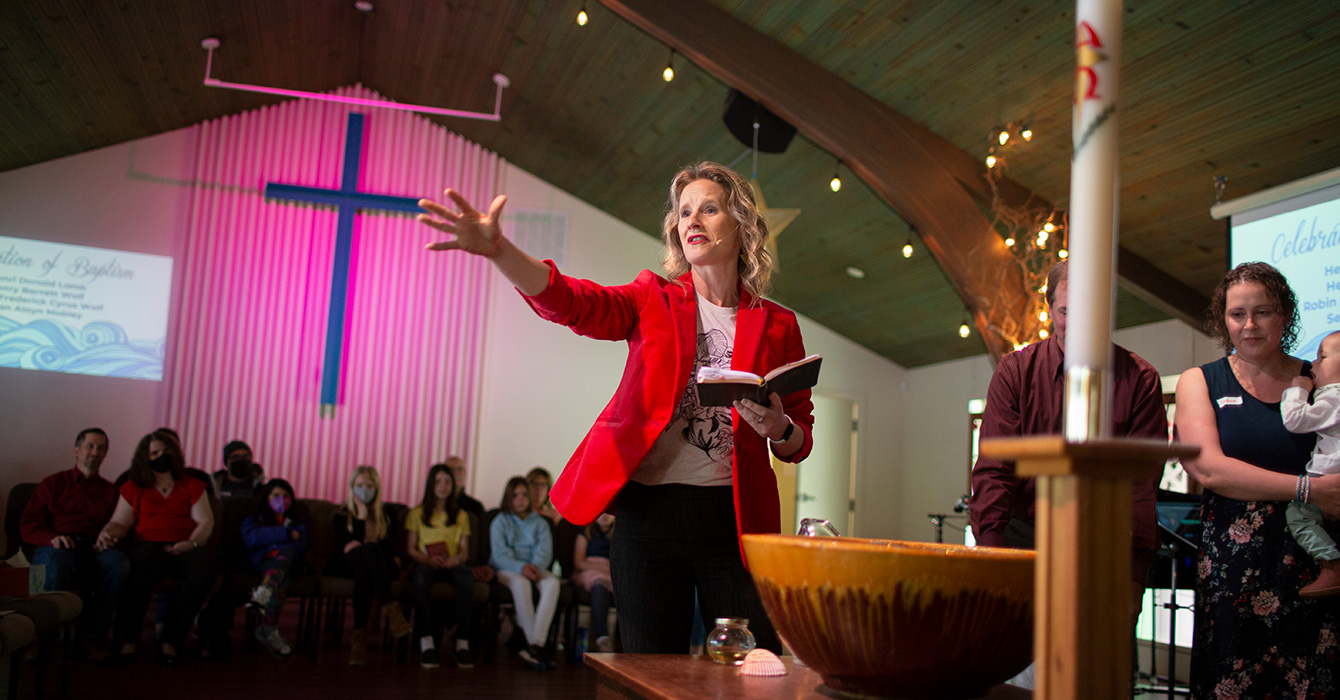 woman preaching during a service
