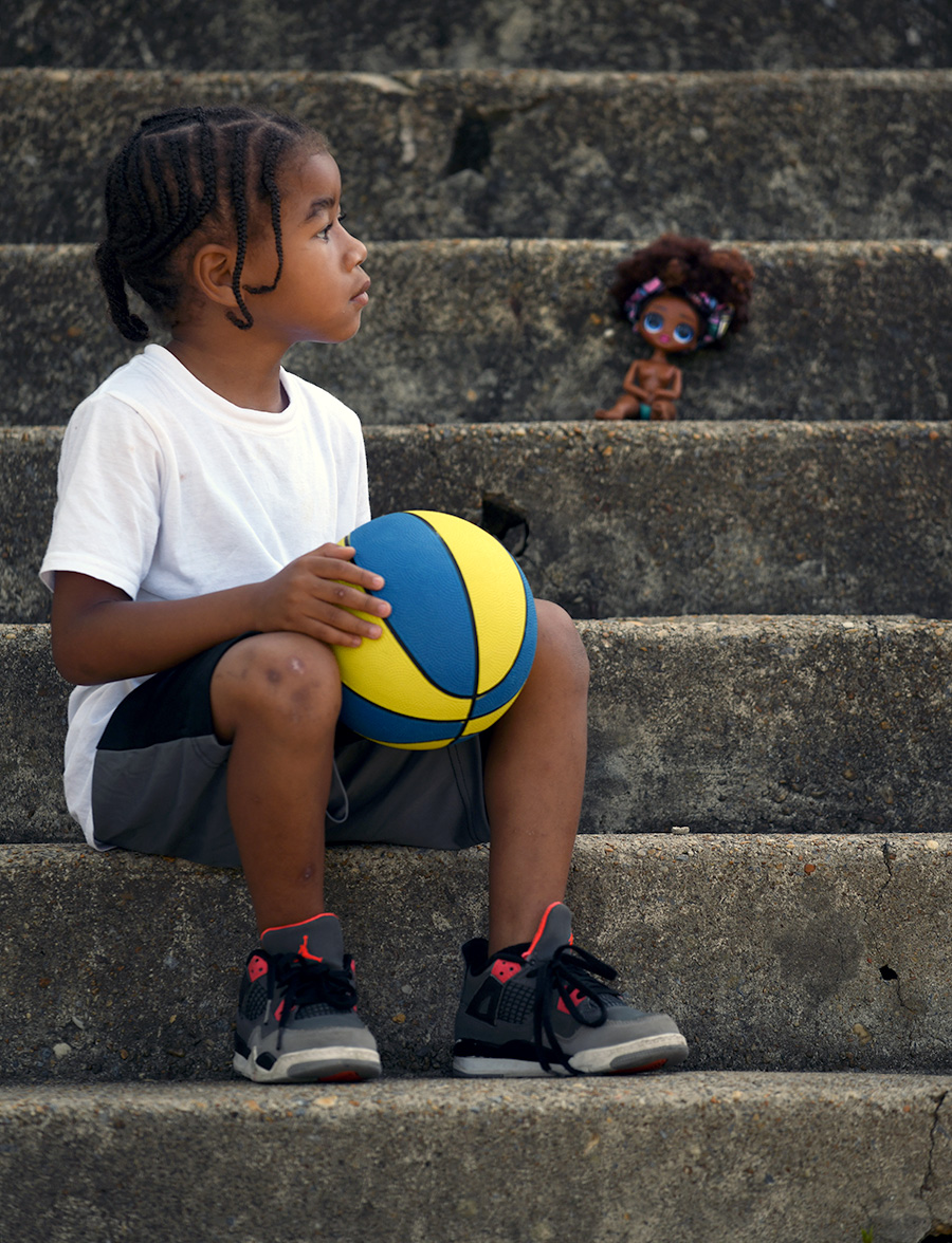 kid sitting on steps