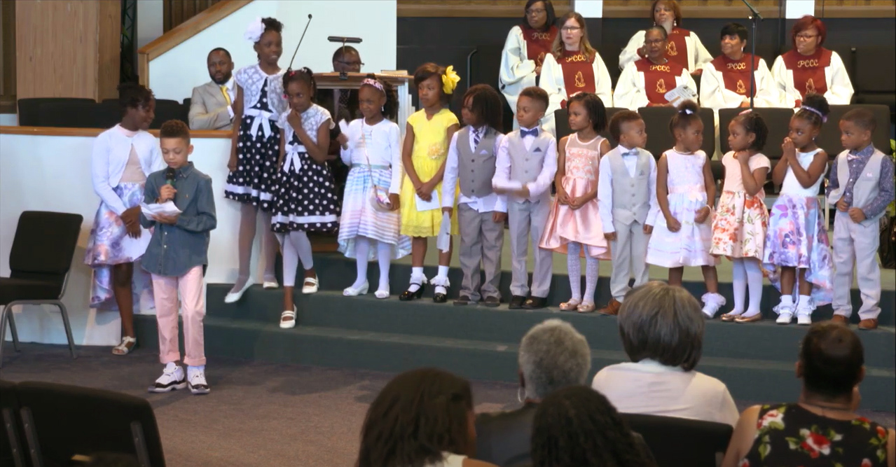 A row of children speaking at church