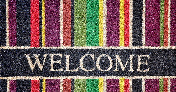 Colorfully striped welcome mat