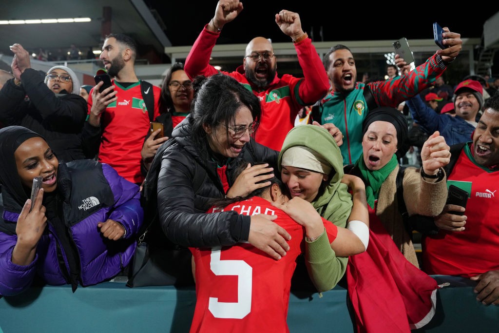 image of a soccer player celebrating with fans