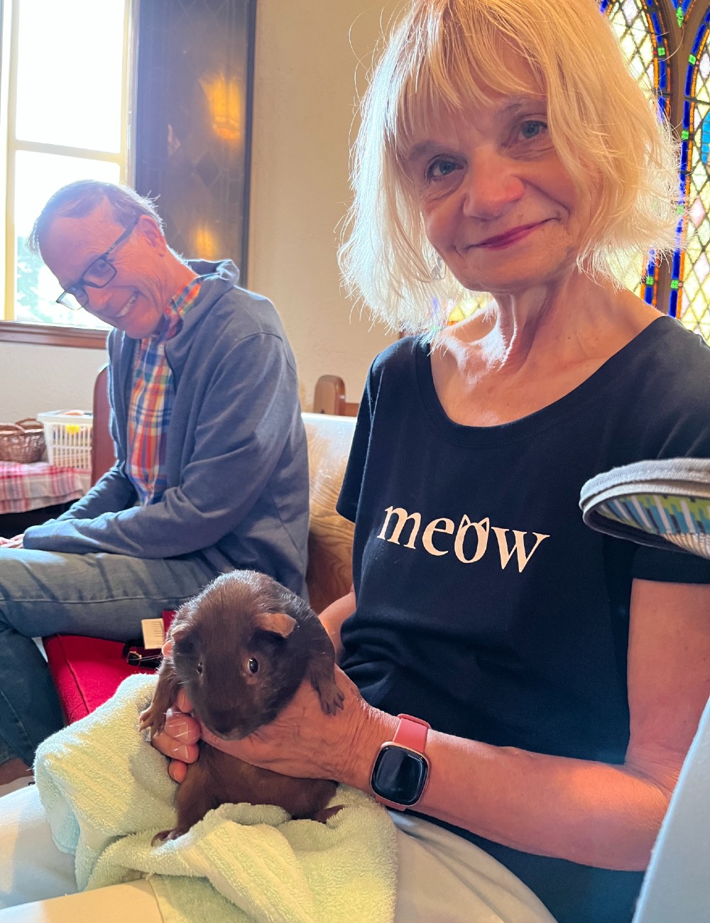 Image of a woman holding a guinea pig