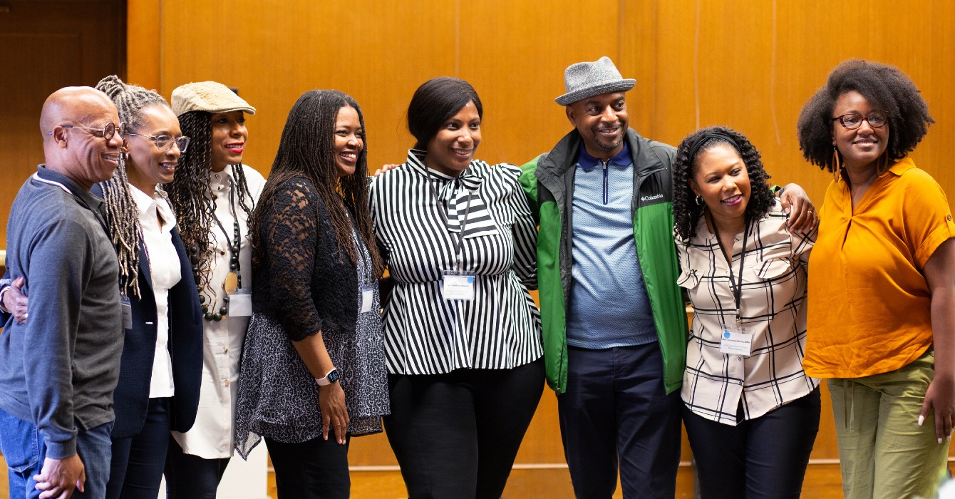 Image of a group of people smiling