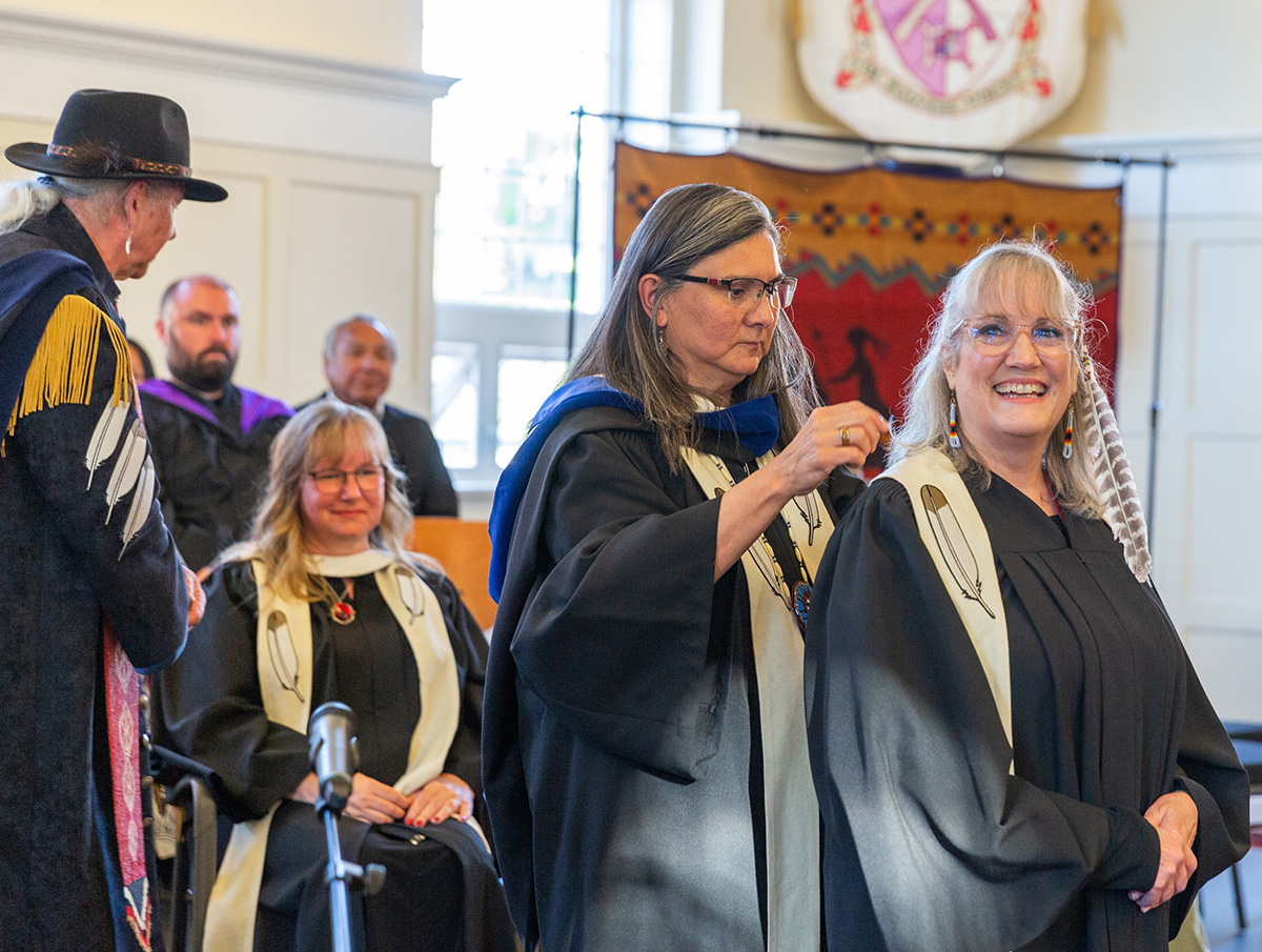 Seminary graduates in black robes