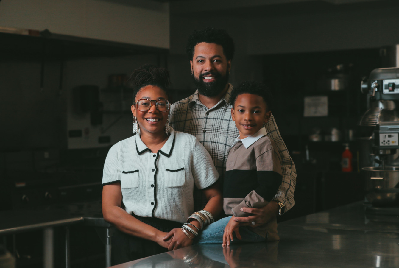 Image of a family standing in a kitchen