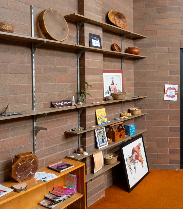 Image of various pieces of art and artifacts displayed in an office