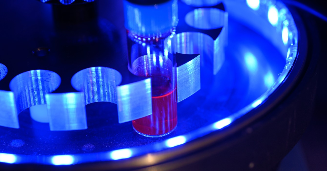 Image of a vial under blue light