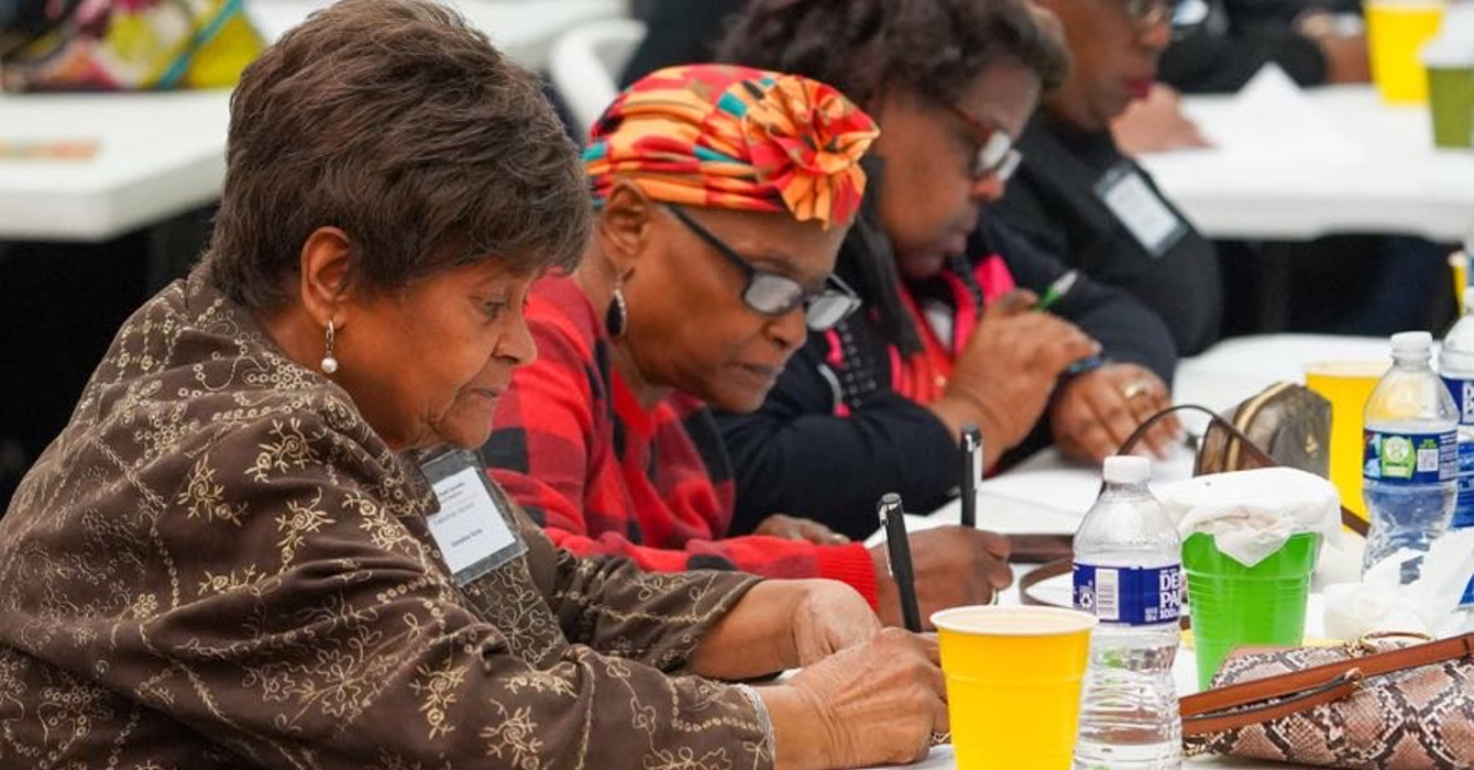 Image of several elderly women taking a survey