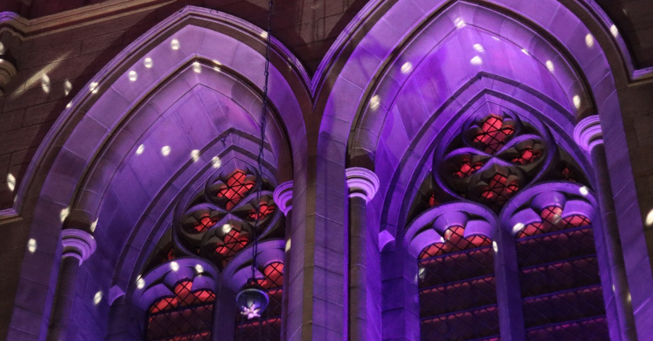 Image of a church windows in a purple light