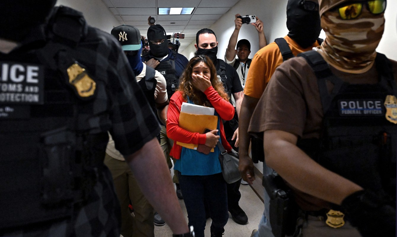 Agents and federal officers assisting ICE detain people after their immigration court hearings at the Jacob Javits Federal Building in New York NY on August 12, 2025.