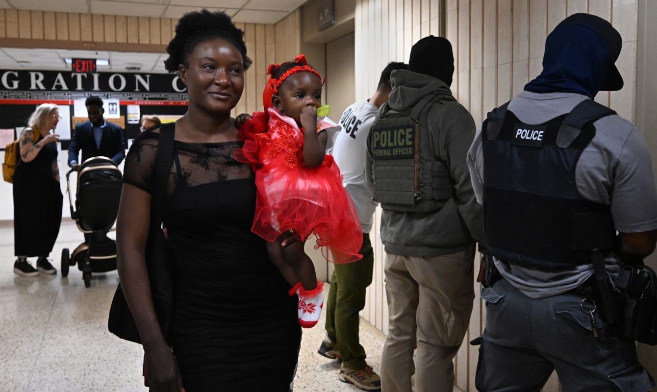 Photo of a woman and child walking