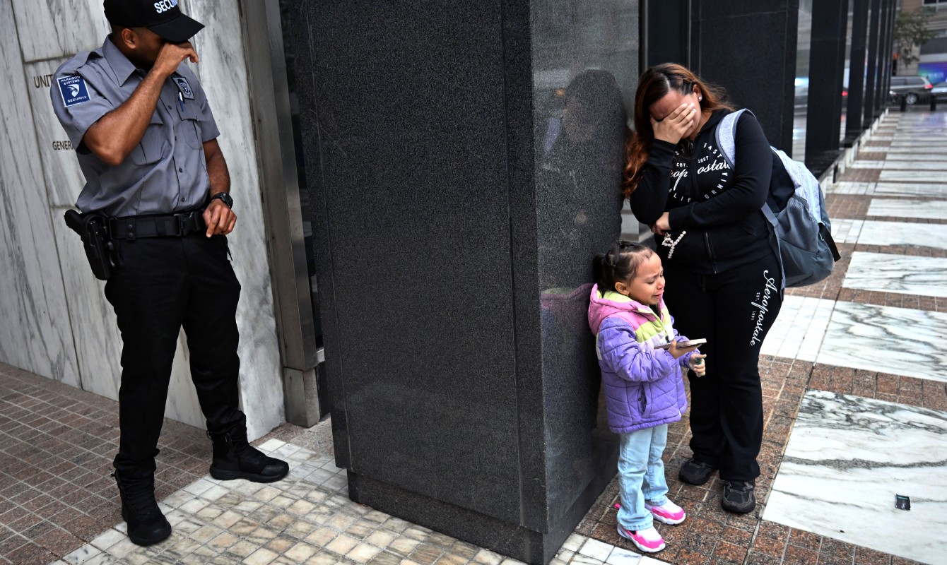 Photo of a woman crying with her daughter