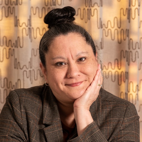 headshot of Dana Neuhauser