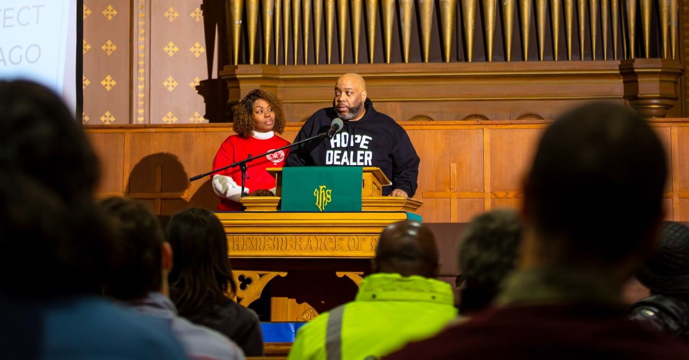 Photo of a pastor in front of a sanctuary