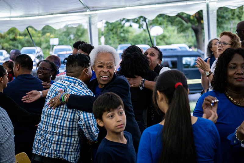 Congregants greet one another