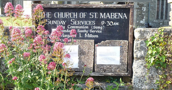 SIgn announcing times of Sunday Services at The Church of St. Mabena