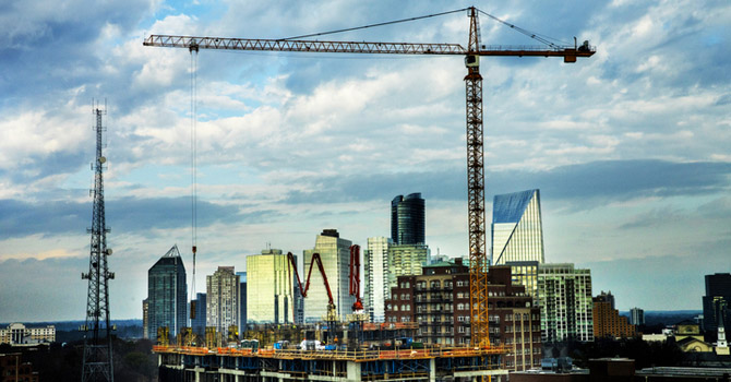 Large crane hovers over a construction site near downtown Atlanta