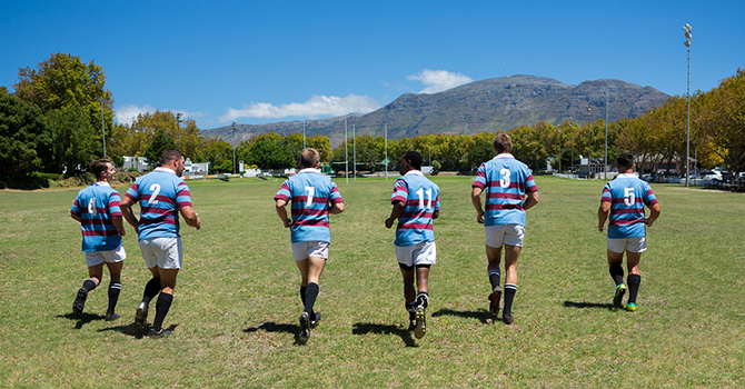 bigstock-Rear-view-of-rugby-team-runnin-188773327.png