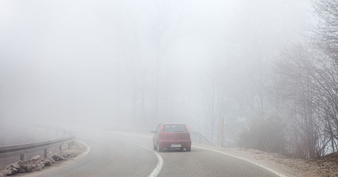 bigstock-Road-and-a-car-in-fog-70595578-lucky-business_m.jpg