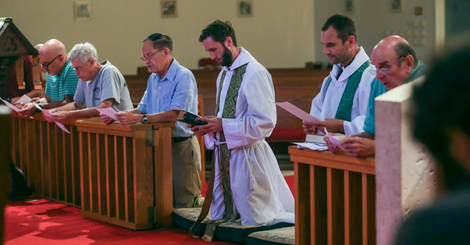 Men kneeling at altar rail