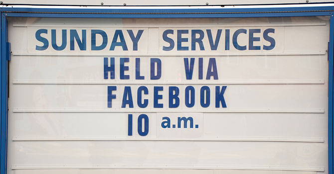 Church marquee reads: Sunday Services held via Facebook 10 a.m. 