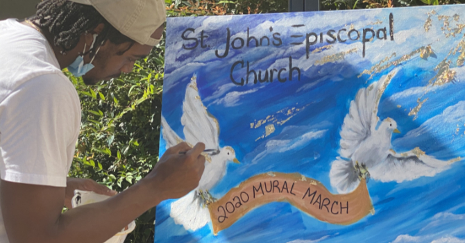 Man painting sign for St. John's Episcopal Church 2000 Mural March